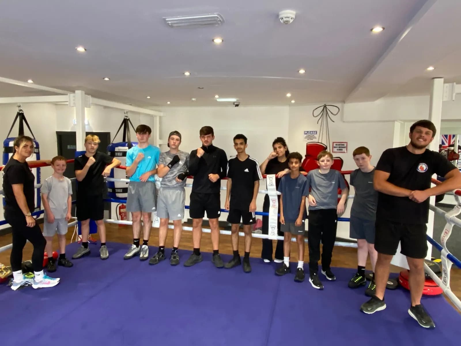 Young people and coaches together after a boxing session